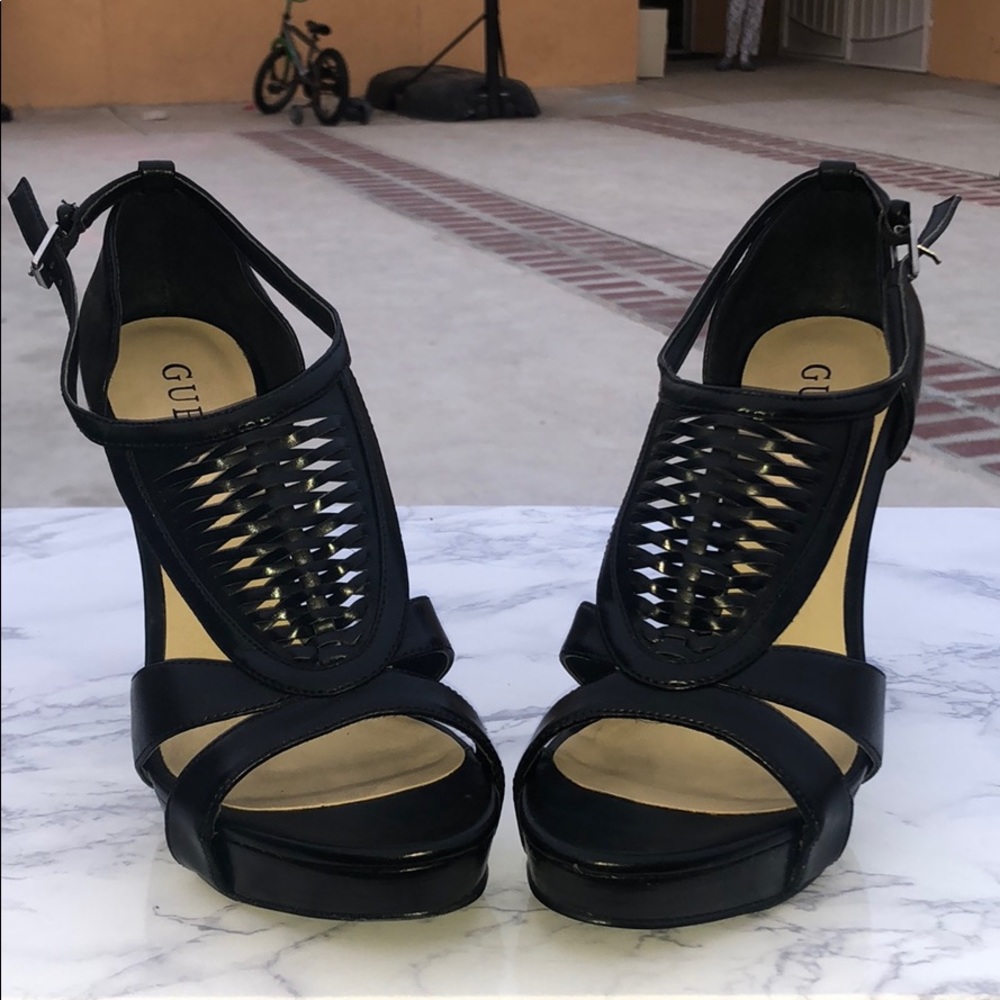 Black synthetic leather high heels